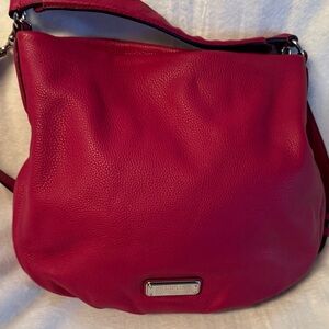 Marc Jacobs red hobo purse. Magnetic snap closure.  Cross body strap incl.